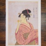 Young Woman Blowing a Glass Pipe (poppin) by Kitagawa Utamaro
